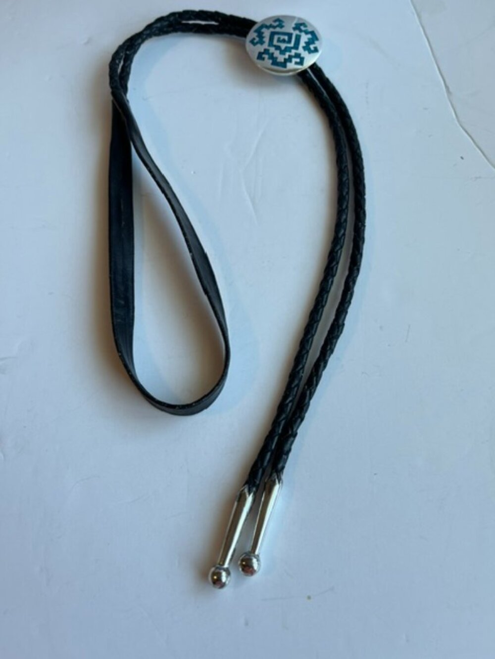 Western style leather bolo tie.